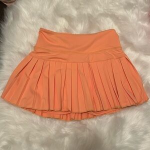 Orange gold hinge skirt